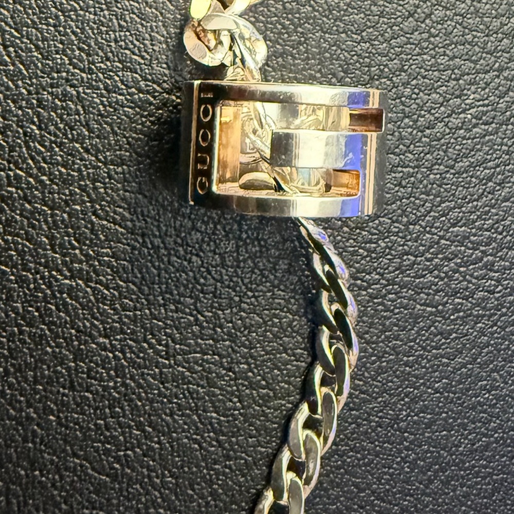 Gucci cut out G ring necklace